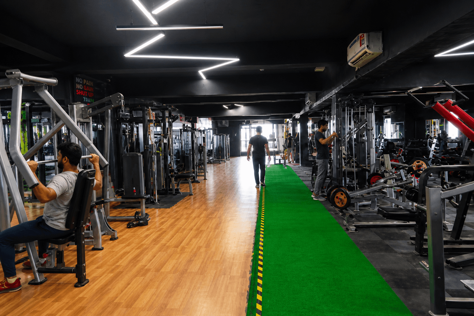 Cable training beside a green turf walkway